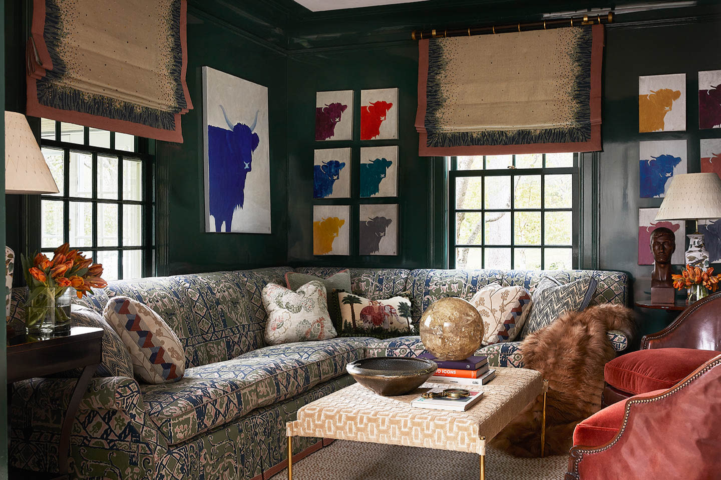 cozy green living room with gallery wall of matching cow prints
