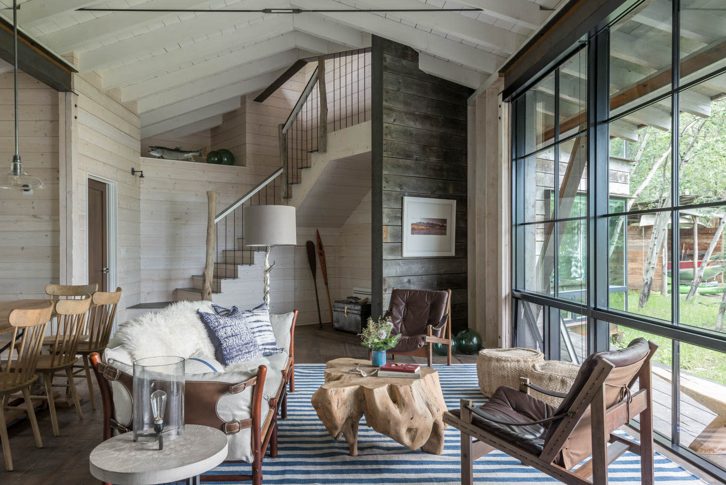 rustic yet contemporary lake house living room with a variety of wood finishes